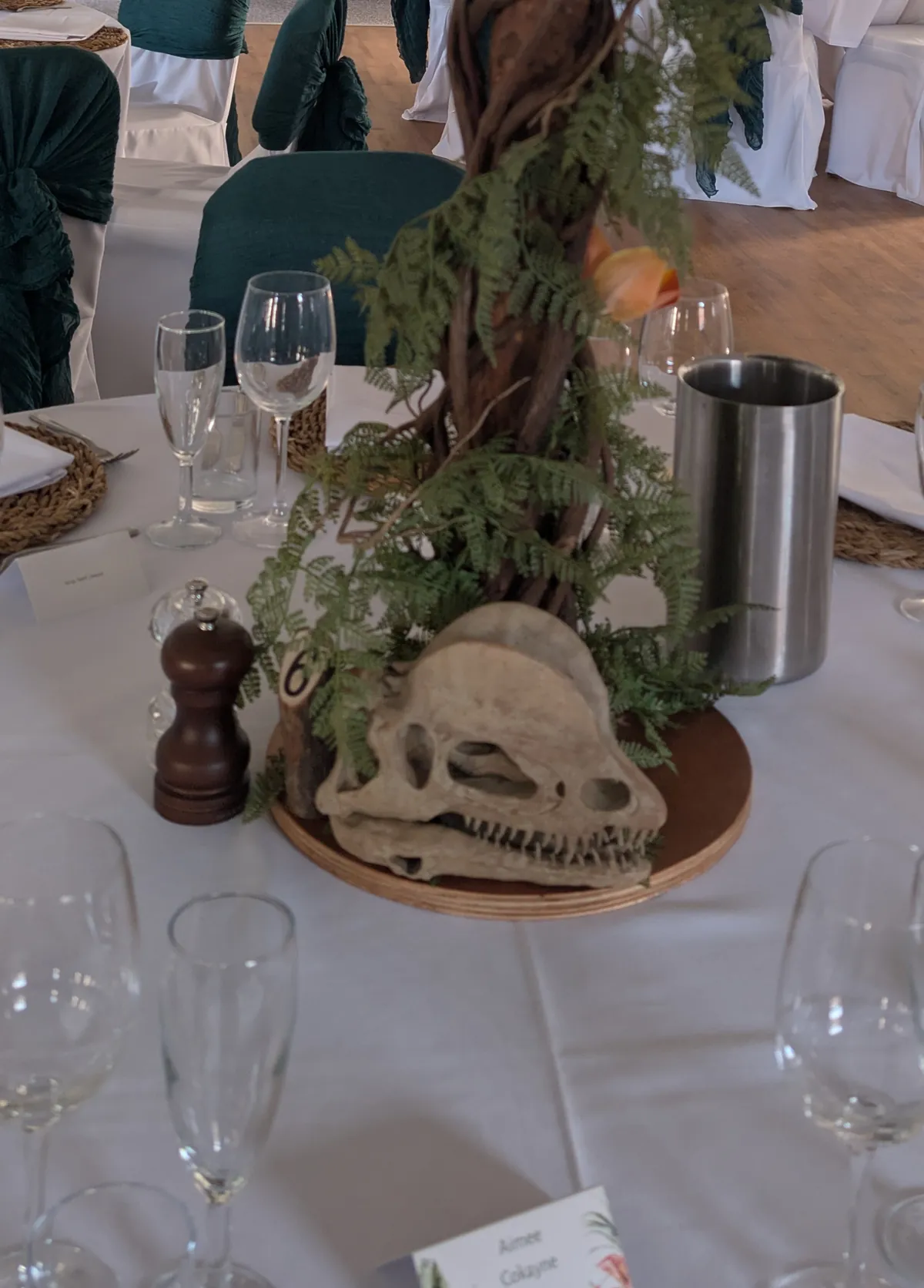In-house 3D-printed dinosaur-skull table centrepiece for a wedding event