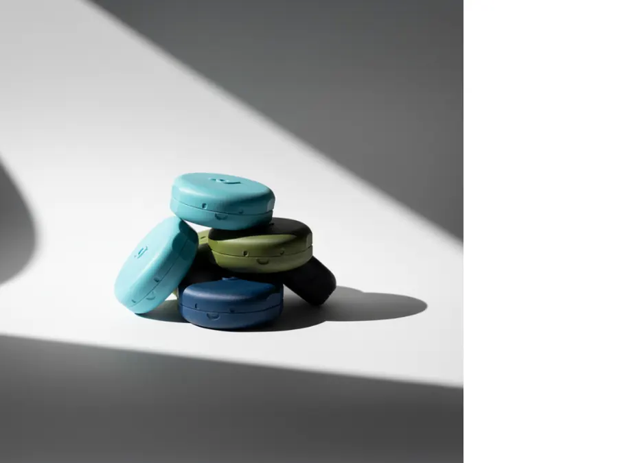 Pebbl case study · batch of teal macaron-shaped containers
