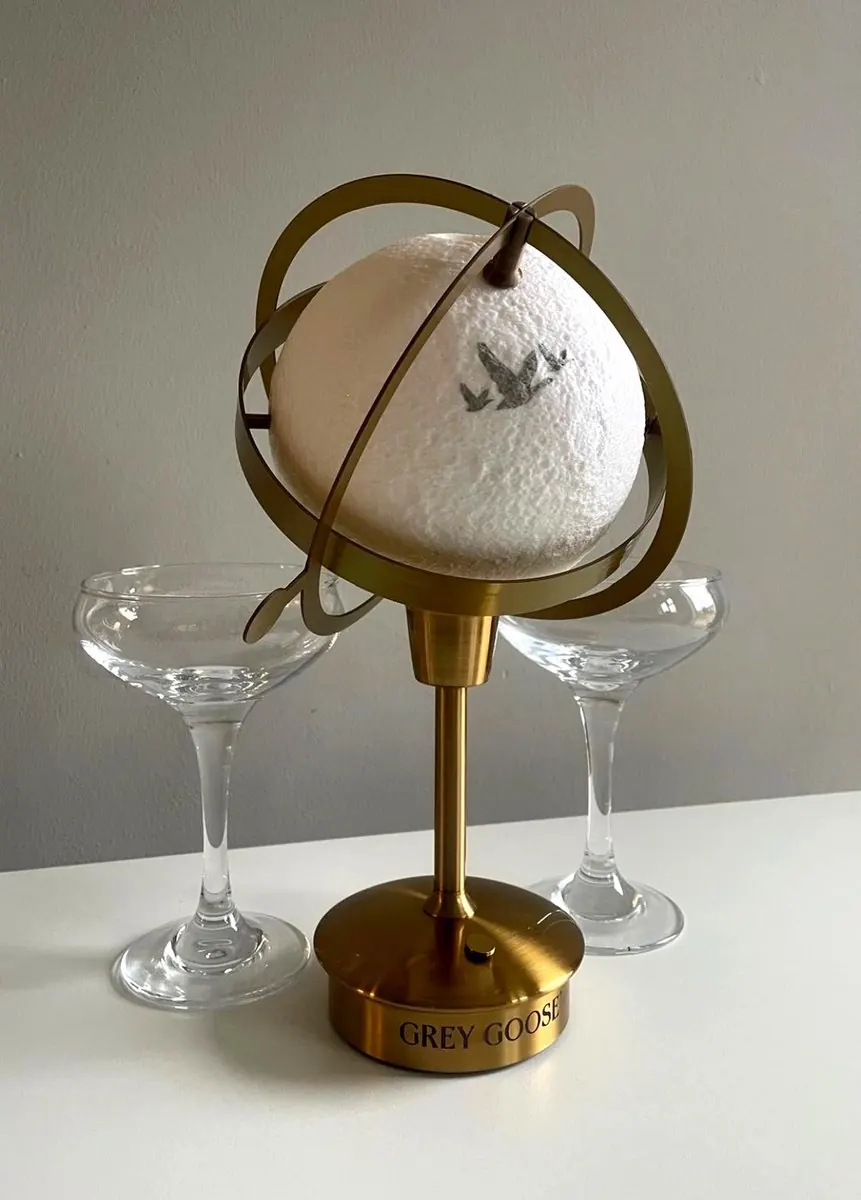 3DPE events · Bruff Drinks moon-globe centrepiece for Grey Goose, brass armillary stand with martini glasses